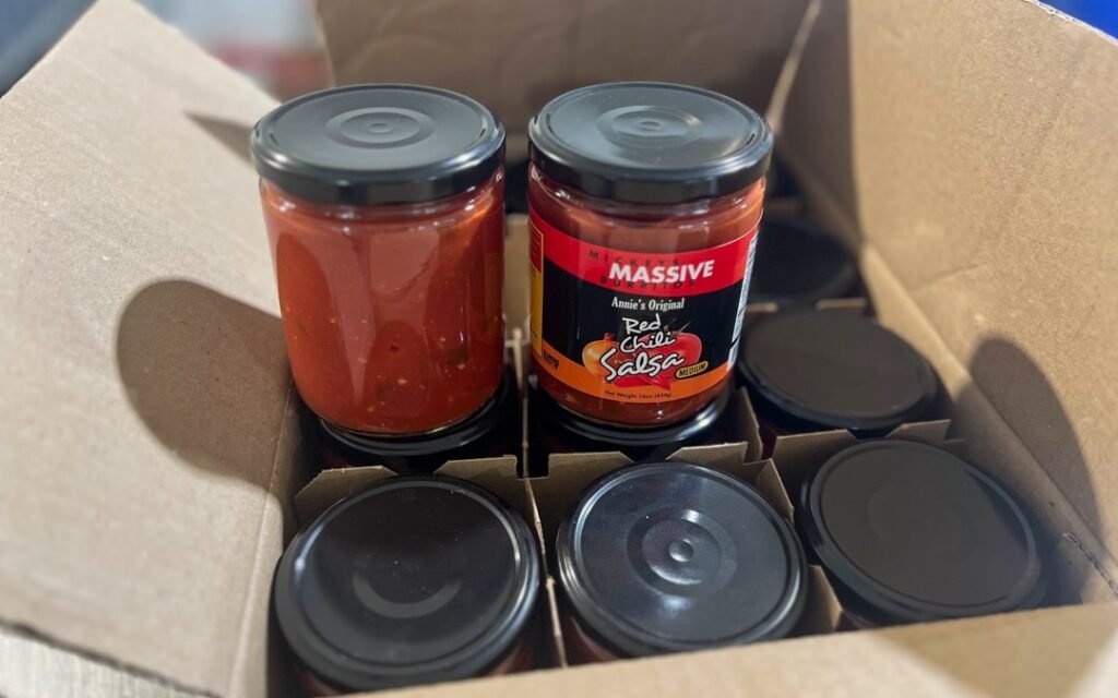 Freshly made private label pasta sauce jars in a small batch setting